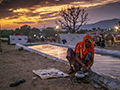 Woman Washing Pots at Pushkar Camel Fair